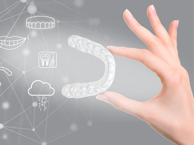 The image depicts a human hand interacting with a digital interface displaying various dental and oral care-related icons, set against a background that suggests a futuristic or technological theme.