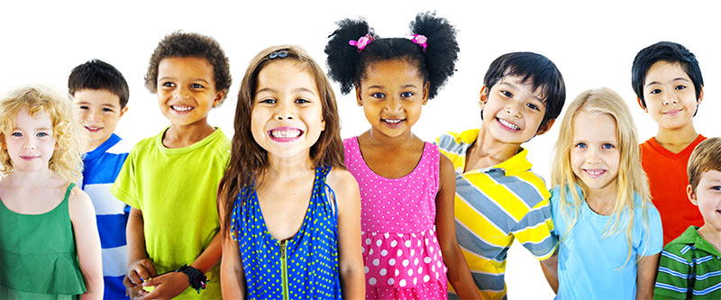 A diverse group of children with different ethnicities and hair colors, all smiling and posing together.